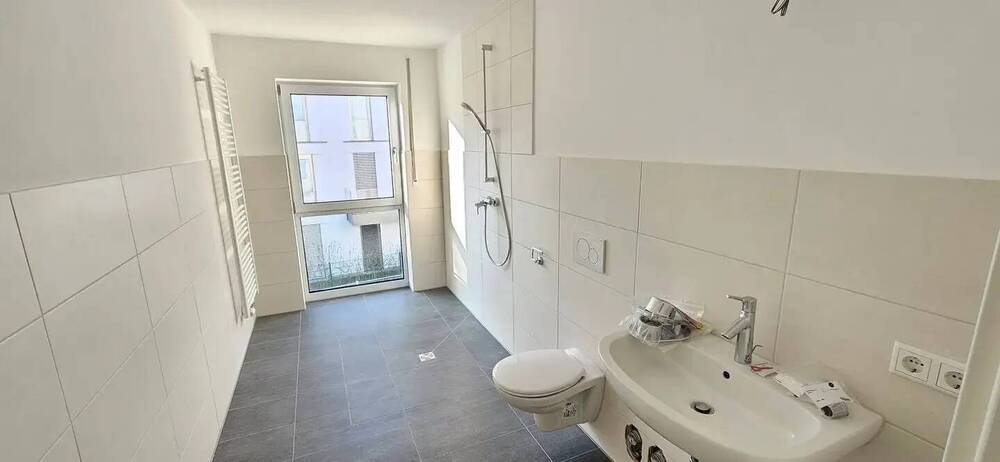 Einziehen und Aufleben - Exklusive 3-Zimmer-Wohnung mit Einbauküche und Balkon und Gartenanteil