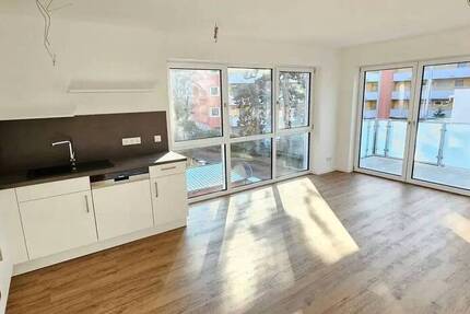 Einziehen und Aufleben - Exklusive 3-Zimmer-Wohnung mit Einbauküche und Balkon und Gartenanteil